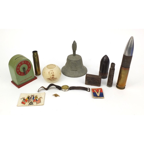 376 - Military related objects including a Buren silver cased trench watch, trench art, Carlton ware Lord ... 