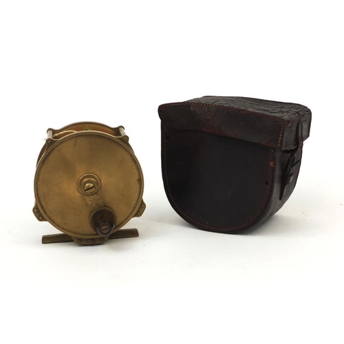 174 - Victorian brass four pillar fishing reel housed in a velvet lined leather case, 10cm in diameter