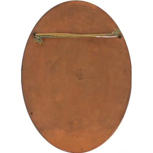 764 - Oval Watcombe terracotta wall plaque, hand painted with flowers, impressed factory marks and numbere... 