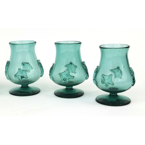 732 - Set of six bottle green glasses with applied decoration, possibly Bohemian, each 12cm high