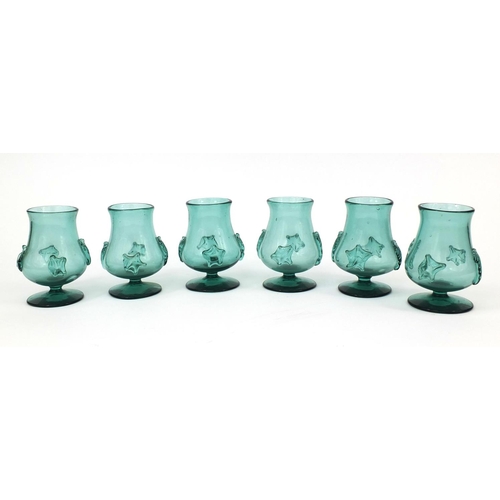 732 - Set of six bottle green glasses with applied decoration, possibly Bohemian, each 12cm high