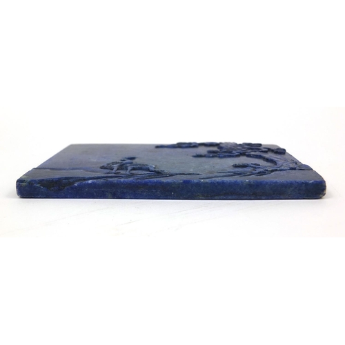 525 - Chinese Lapis Lazuli panel raised on a pierced hardwood stand, the panel carved with two cranes besi... 