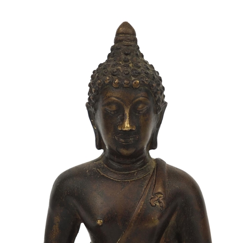 553 - Chino Tibetan bronze Buddha seated in the lotus position, 21cm high