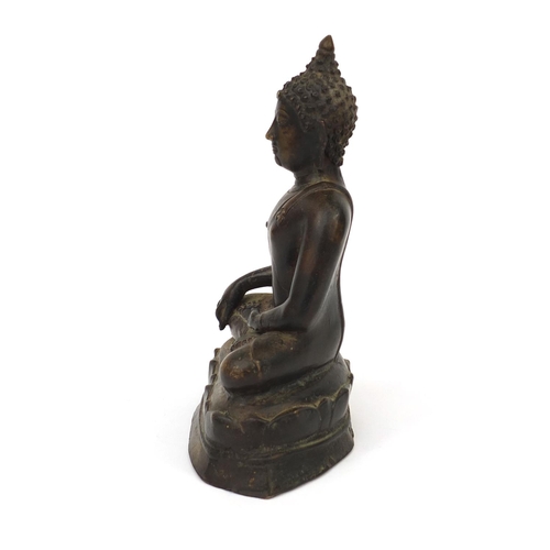 553 - Chino Tibetan bronze Buddha seated in the lotus position, 21cm high