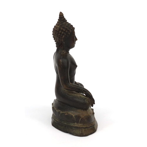 553 - Chino Tibetan bronze Buddha seated in the lotus position, 21cm high