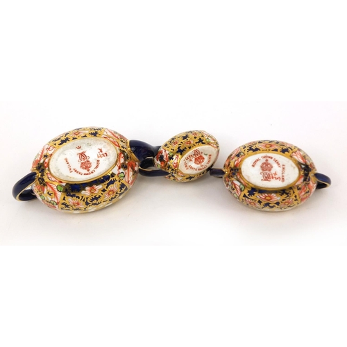 690 - Miniature Royal Crown Derby Imari pattern three piece tea set, comprising teapot, sugar bowl and mil... 