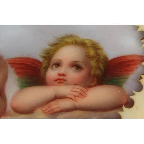 665 - Meissen oval porcelain panel hand painted with two cherubs after Raphael, housed in a pierced ivory ... 