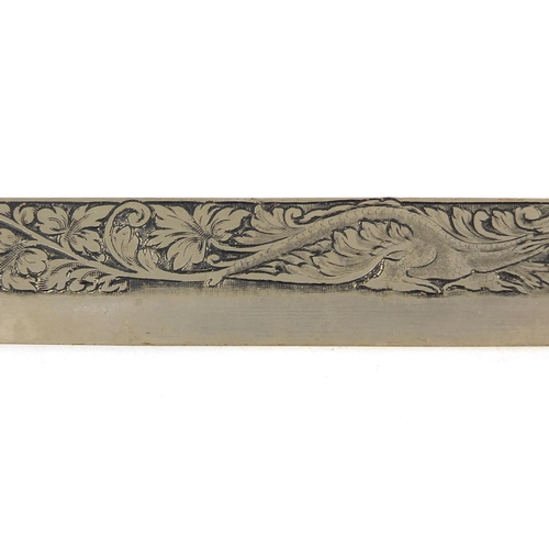 396 - Ivory handled steel knife profusely engraved with a dragon amongst flowers and foliate scrolls, 27cm... 