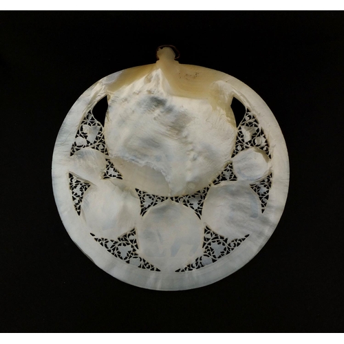 10 - Mother of Pearl shell carved with The Last Supper, profusely pierced with flowers and foliage, 16.5c... 