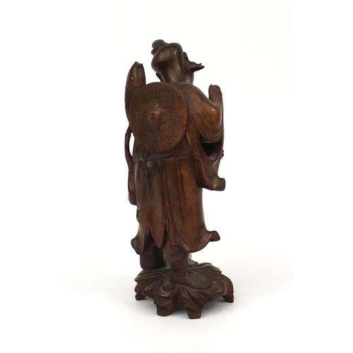 543 - Chinese hardwood root carving of a fisherman holding a fish, 30cm high