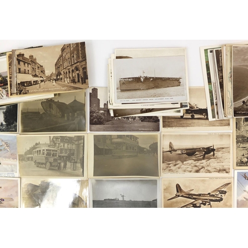 207 - Group of Military interest and topographical postcards and photographs including tanks, buses and ba... 