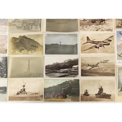 207 - Group of Military interest and topographical postcards and photographs including tanks, buses and ba... 