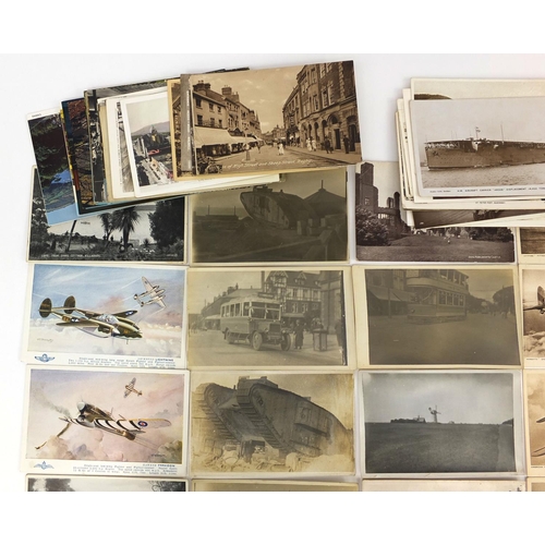 207 - Group of Military interest and topographical postcards and photographs including tanks, buses and ba... 