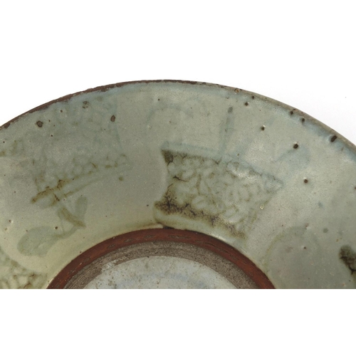 493 - Chinese celadon glazed Swatow shallow dish, hand painted with baskets, 26cm in diameter