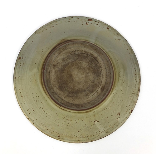 493 - Chinese celadon glazed Swatow shallow dish, hand painted with baskets, 26cm in diameter