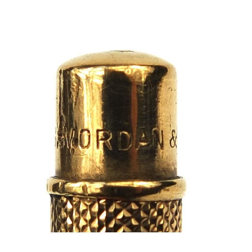 121 - S Mordan & Co 9ct gold propelling pencil retailed by Apsrey, with engine turned decoration and bank ... 