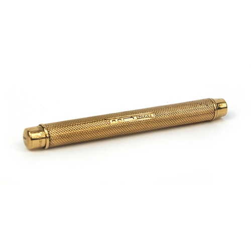 121 - S Mordan & Co 9ct gold propelling pencil retailed by Apsrey, with engine turned decoration and bank ... 