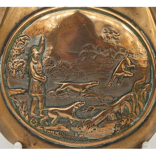 382 - 19th century copper and brass powder flask embossed with a hunting scene, 21cm in length