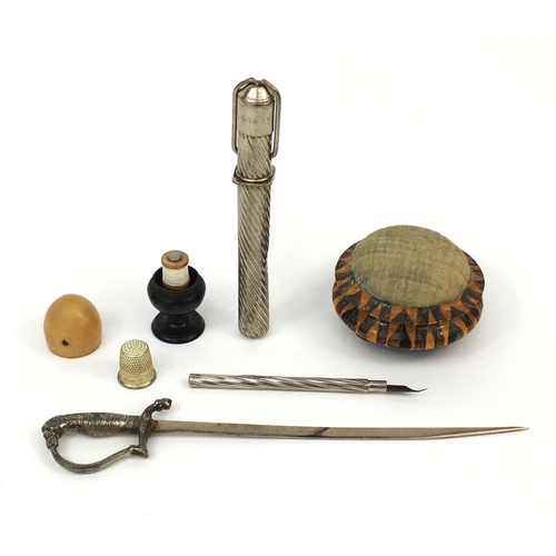 149 - Objects including a Tunbridge ware pin cushion, acorn shaped thimble holder and a German travelling ... 