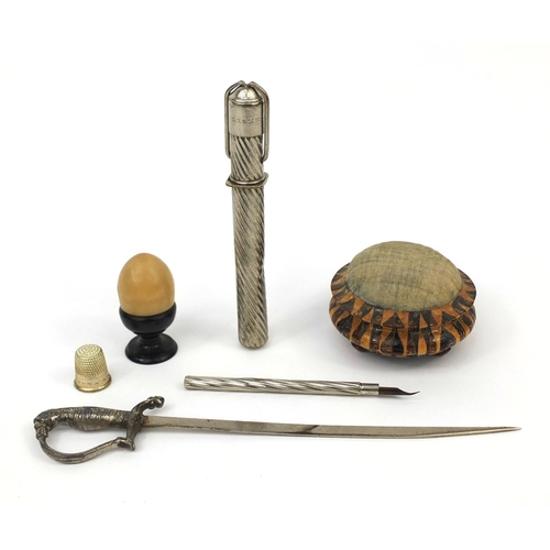 149 - Objects including a Tunbridge ware pin cushion, acorn shaped thimble holder and a German travelling ... 