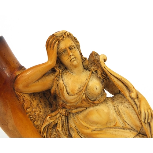 108 - Meerschaum pipe carved with a semi nude maiden holding a bow, with amber coloured mouth and end piec... 