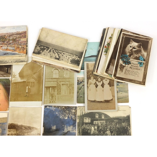 204 - Group of postcards including Military, Oriental and topographical examples, some photographic exampl... 