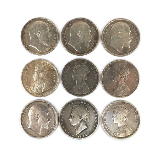 308 - Eight British colonial Indian one rupees, together with an 1829 George IV silver half crown, the rup... 