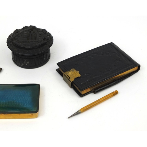 154 - Objects including an Art Nouveau desk inkwell, bog oak pot and cover decorated with Muckross Cathedr... 