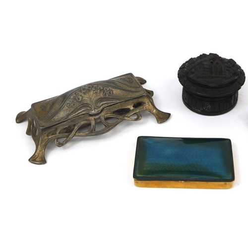 154 - Objects including an Art Nouveau desk inkwell, bog oak pot and cover decorated with Muckross Cathedr... 