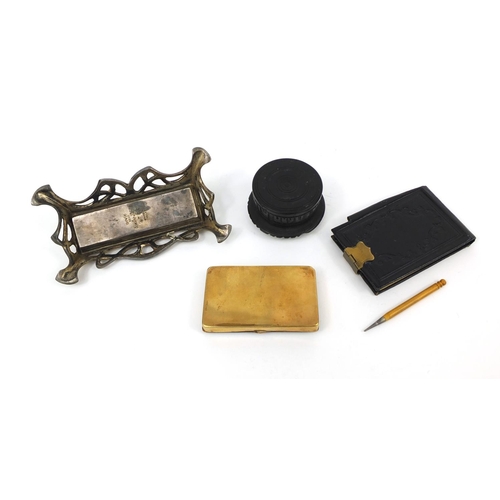 154 - Objects including an Art Nouveau desk inkwell, bog oak pot and cover decorated with Muckross Cathedr... 