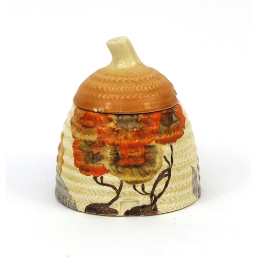 756 - Clarice Cliff Newport pottery honey pot and cover, factory marks to the base, 11cm high