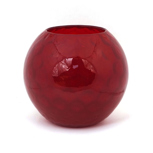 746 - Red Art glass vase of globular form, relief decorated to the interior, 21cm high