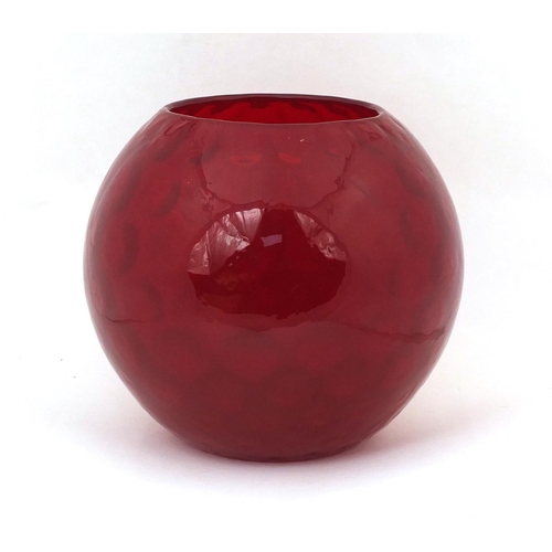 746 - Red Art glass vase of globular form, relief decorated to the interior, 21cm high