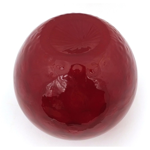 746 - Red Art glass vase of globular form, relief decorated to the interior, 21cm high