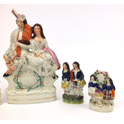 707 - Five Victorian Staffordshire pottery figure groups including Highland dancer clock example and a Sta... 