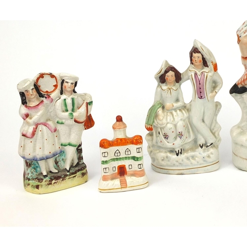 707 - Five Victorian Staffordshire pottery figure groups including Highland dancer clock example and a Sta... 