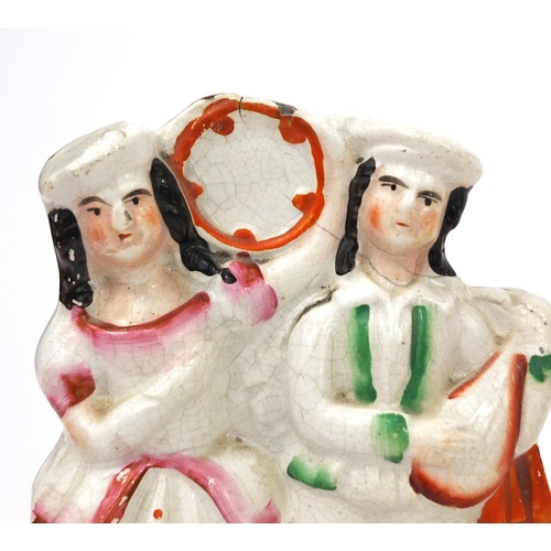 707 - Five Victorian Staffordshire pottery figure groups including Highland dancer clock example and a Sta... 