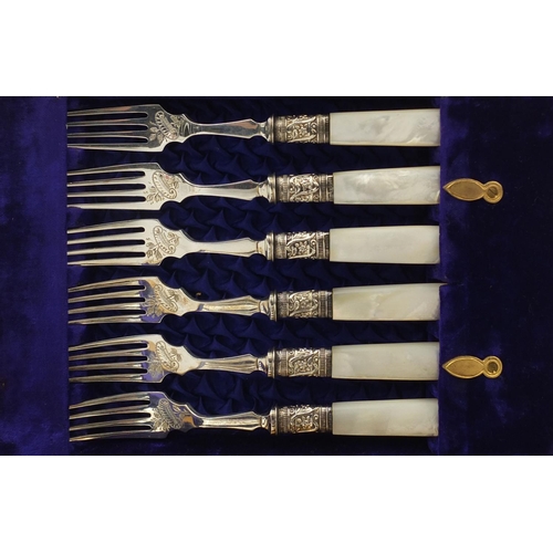 858 - Canteen of six silver Victorian Mother of Pearl fish knives and forks, each with floral chased decor... 