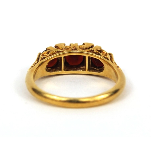 967 - 18ct gold garnet and clear stone ring, size L, approximate weight 4.3g