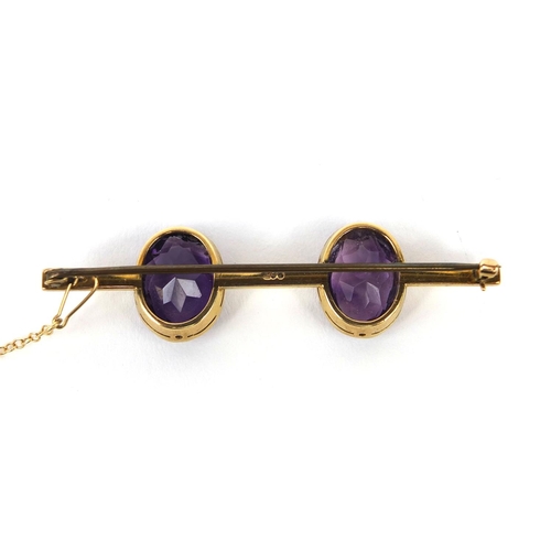 992 - 9ct gold amethyst bar brooch, 5.5cm long, approximate weight 7.3g