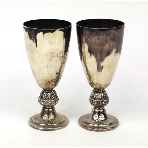 815 - *Description amended 27-04-17* Pair of Irish silver chalices, the stems with animal head decoration,... 