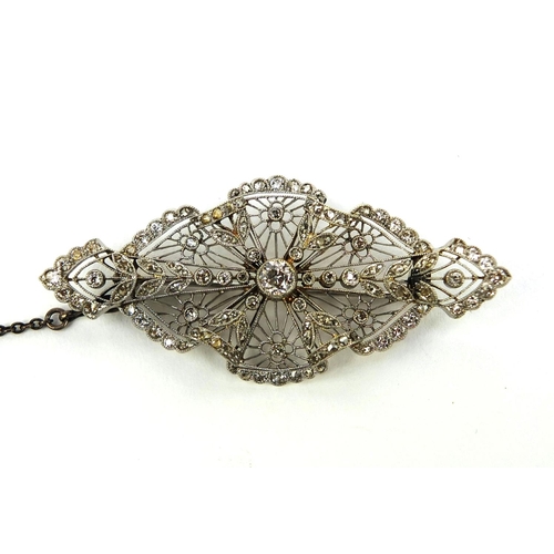 909 - Edwardian unmarked platinum fine lace work diamond brooch, 5.5cm long, approximate weight 10.0g with... 