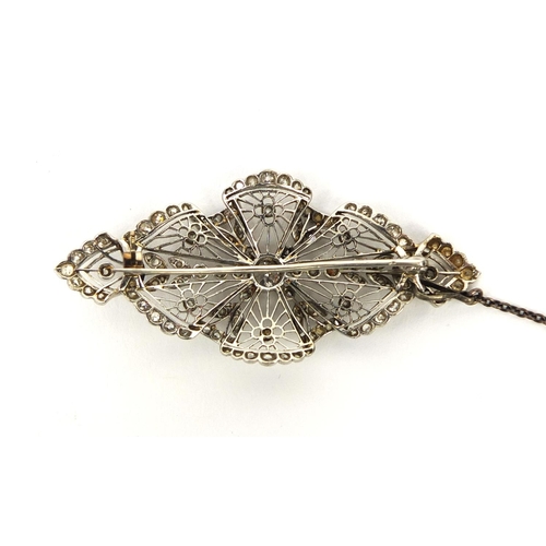 909 - Edwardian unmarked platinum fine lace work diamond brooch, 5.5cm long, approximate weight 10.0g with... 