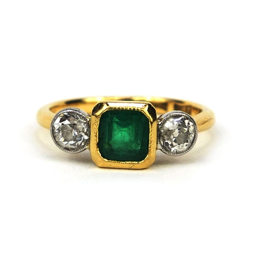 917 - 18ct gold emerald and diamond ring, set with a square cut emerald and two solitaire diamonds, size M... 