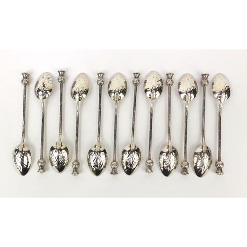 884 - Set of twelve silver teaspoons with thistle terminals, each stamped Kirkpatrick sterling, 12.5cm lon... 