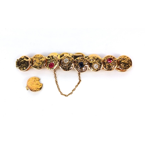 916 - Designer unmarked gold bracelet set with diamonds, ruby's and a sapphire, 18cm long, approximate wei... 