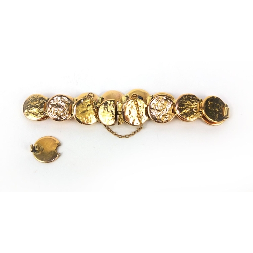 916 - Designer unmarked gold bracelet set with diamonds, ruby's and a sapphire, 18cm long, approximate wei... 