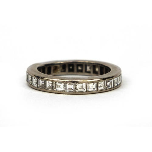 934 - Unmarked white metal diamond eternity ring, set with approximately twenty seven diamonds, size J, ap... 