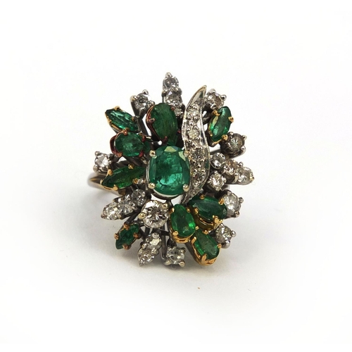 921 - Unmarked white metal emerald and diamond cocktail ring, set with ten emeralds and twenty four diamon... 