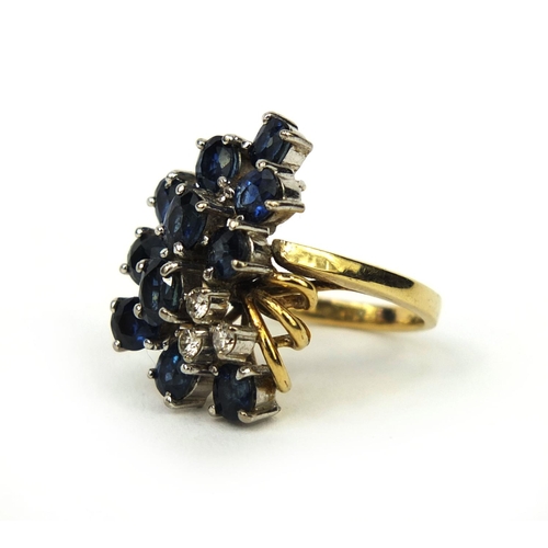 937 - 14ct gold sapphire and diamond cocktail ring set with eleven sapphires and three diamonds, size F, a... 